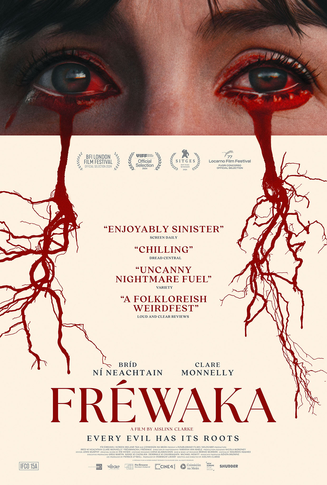 Text on poster: “Fréwaka.” “Every evil has its roots.” The image shows close-up eyes with red, root-like streams flowing downward.