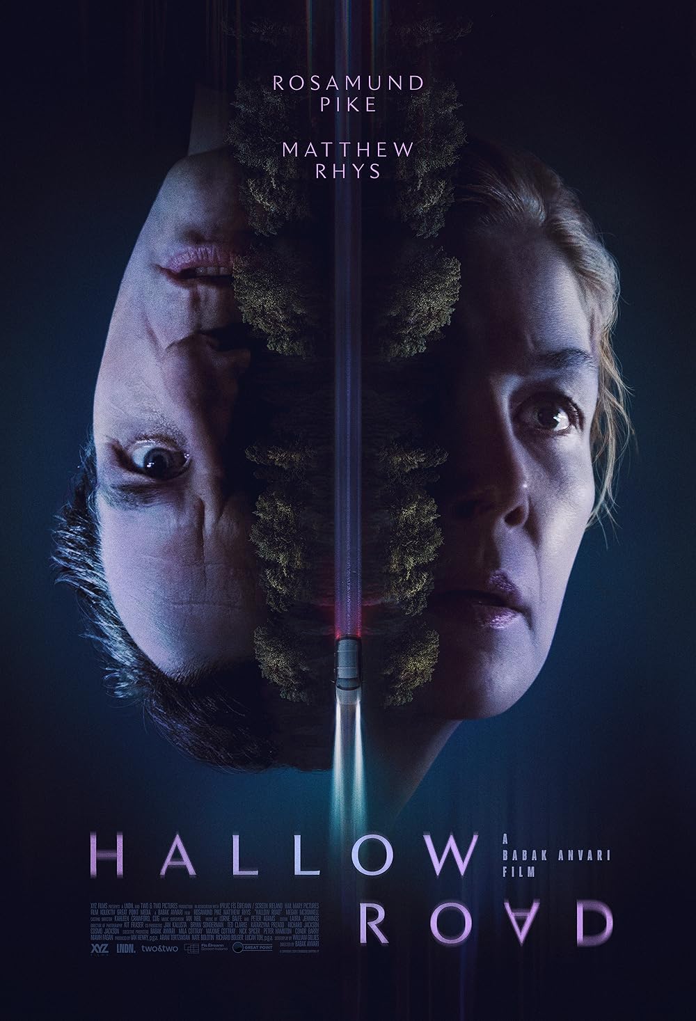 Text on poster: “Hallow Road.” Rosamund Pike. Matthew Rhys. The image shows two mirrored faces split by a central vertical line.