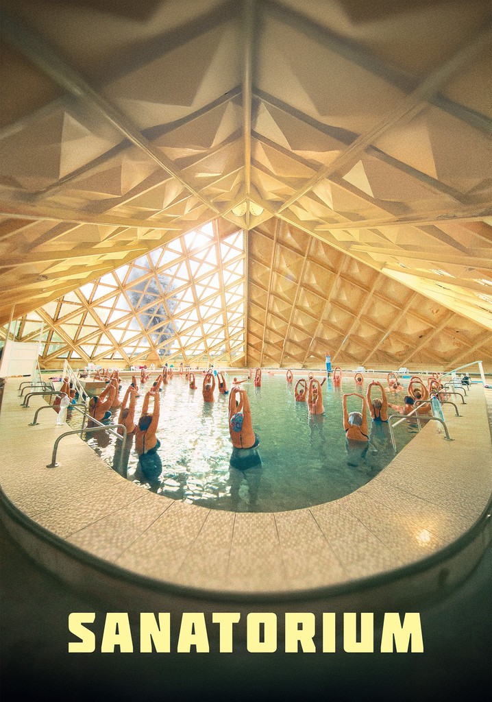 Text on poster: “Sanatorium.” The image shows people standing in an indoor pool beneath a geometric roof.